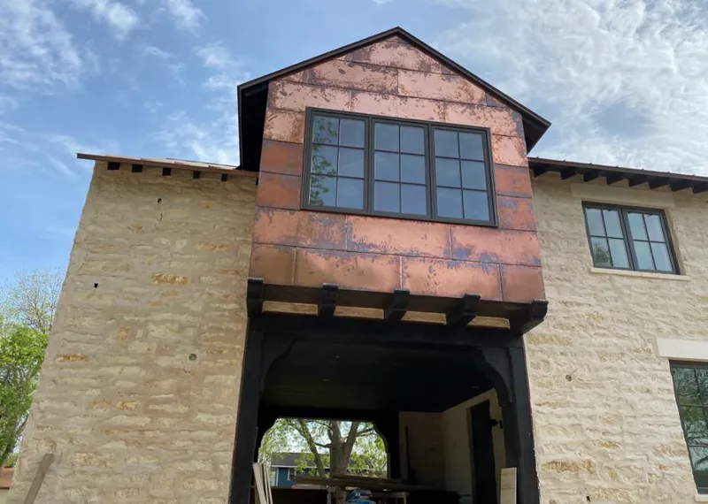 Copper metal panel facade on a stone building for Roof Repair in New Freedom